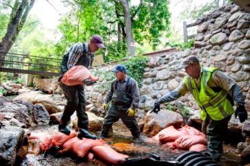 Workers-attempt-to-divert-Cheyenne-Creek-to-begin-repairs-on-the-foundation-of-a-bridge-The-Gazette2