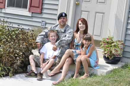 military-family-in-front-of-home